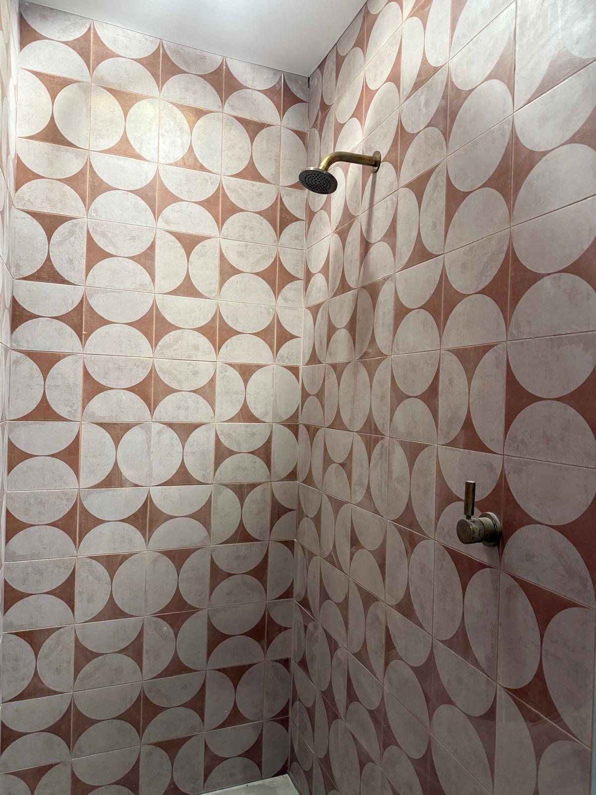 Tiled shower with brass tapware